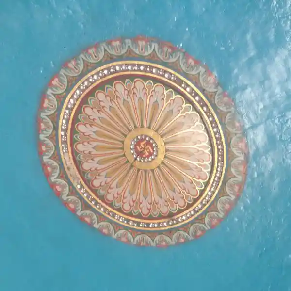 Swastika in the middle of a solar disc on the ceiling of Indian infrastructure